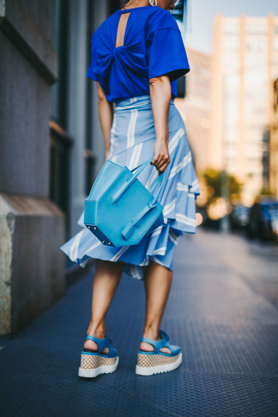 jessica wang wearing a blue shirt, asymmetrical skirt, and cut out platform sneakers // Jessica Wang - Notjessfashion.com