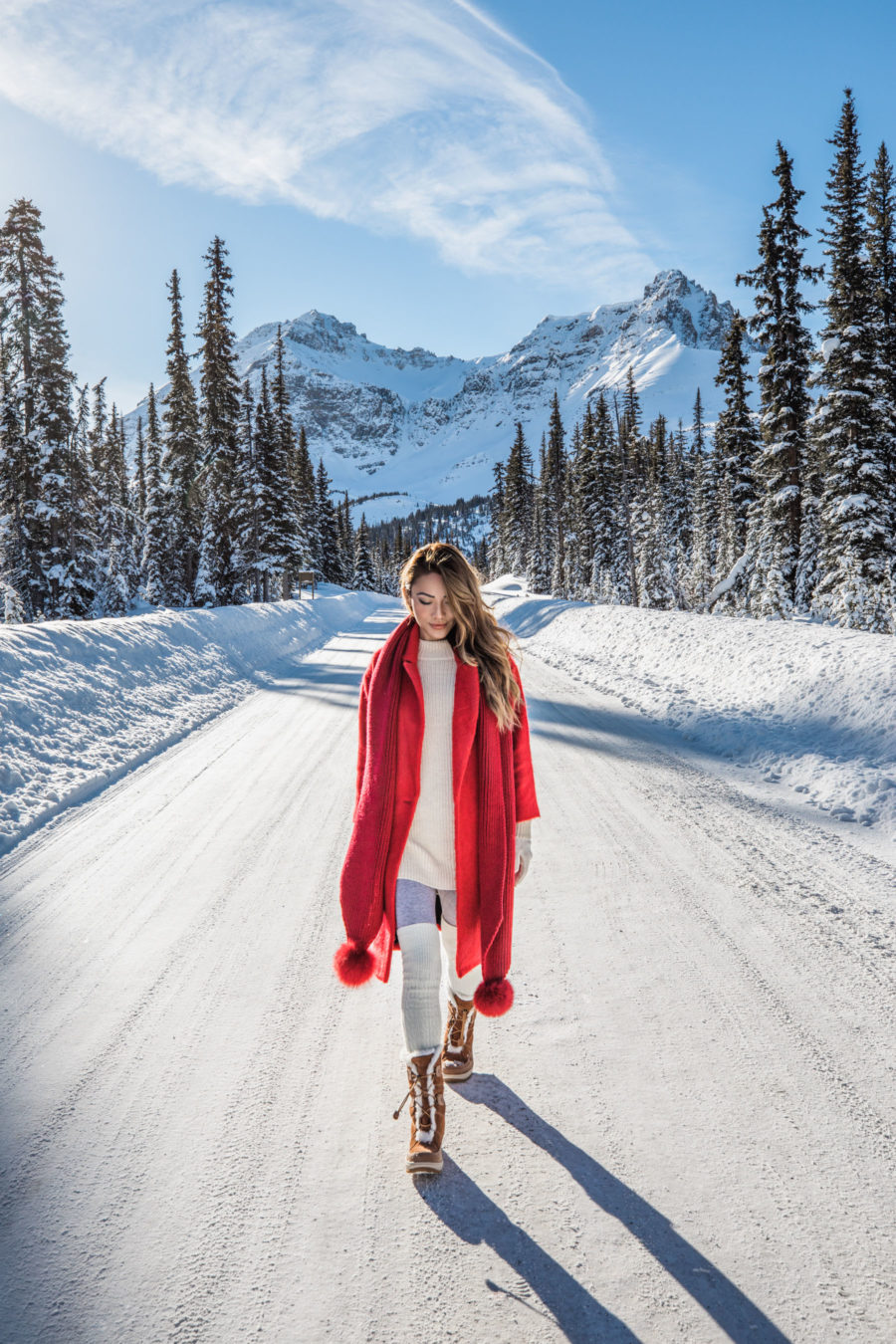 Winter Packing Tips - Red Coat with Pom Pom Scarf and Snow Boots // Notjessfashion.com