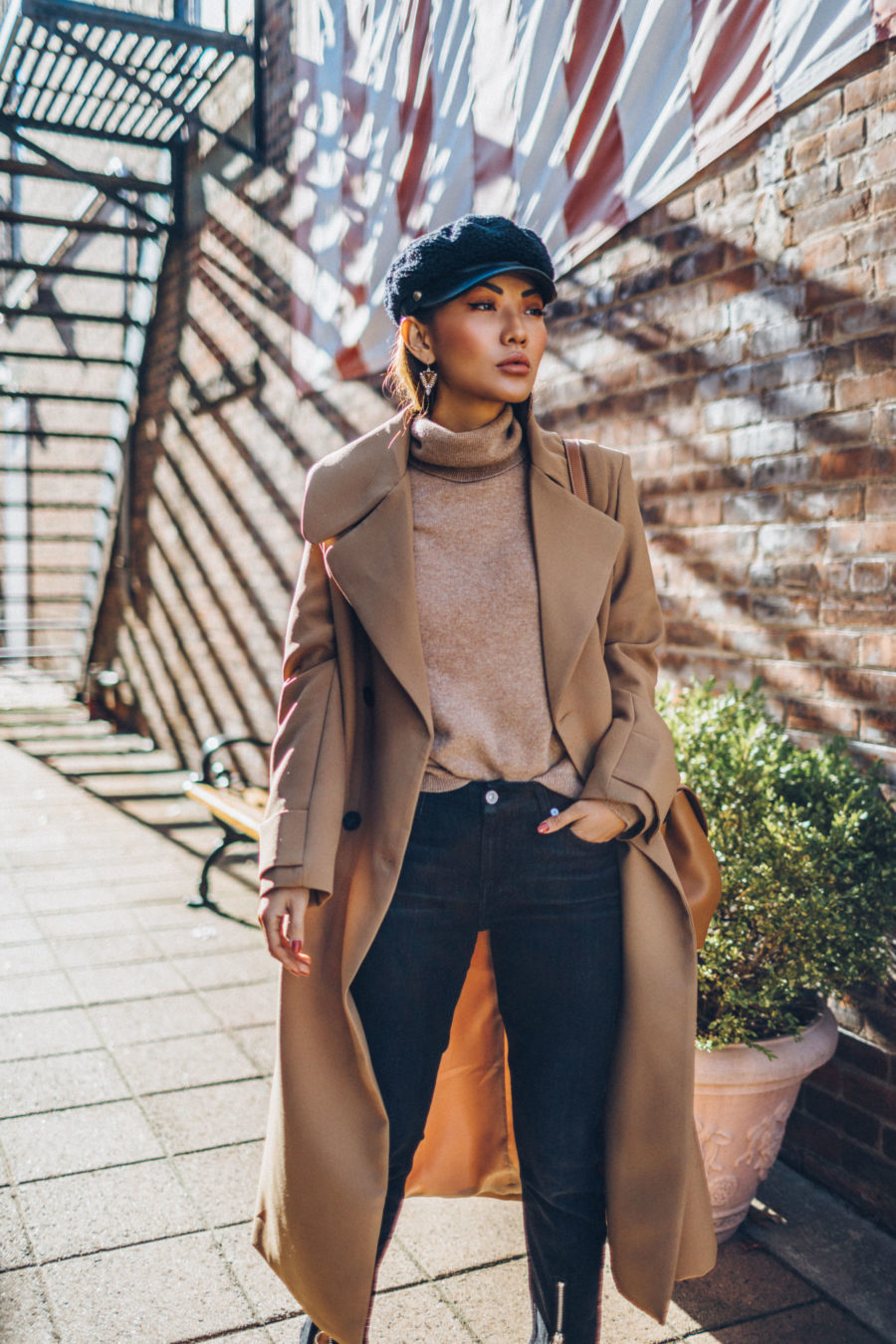 How to Buy an Investment Coat - Belted Camel Coat with Dark Denim Baker Boy Cap and Satchel // Notjessfashion.com