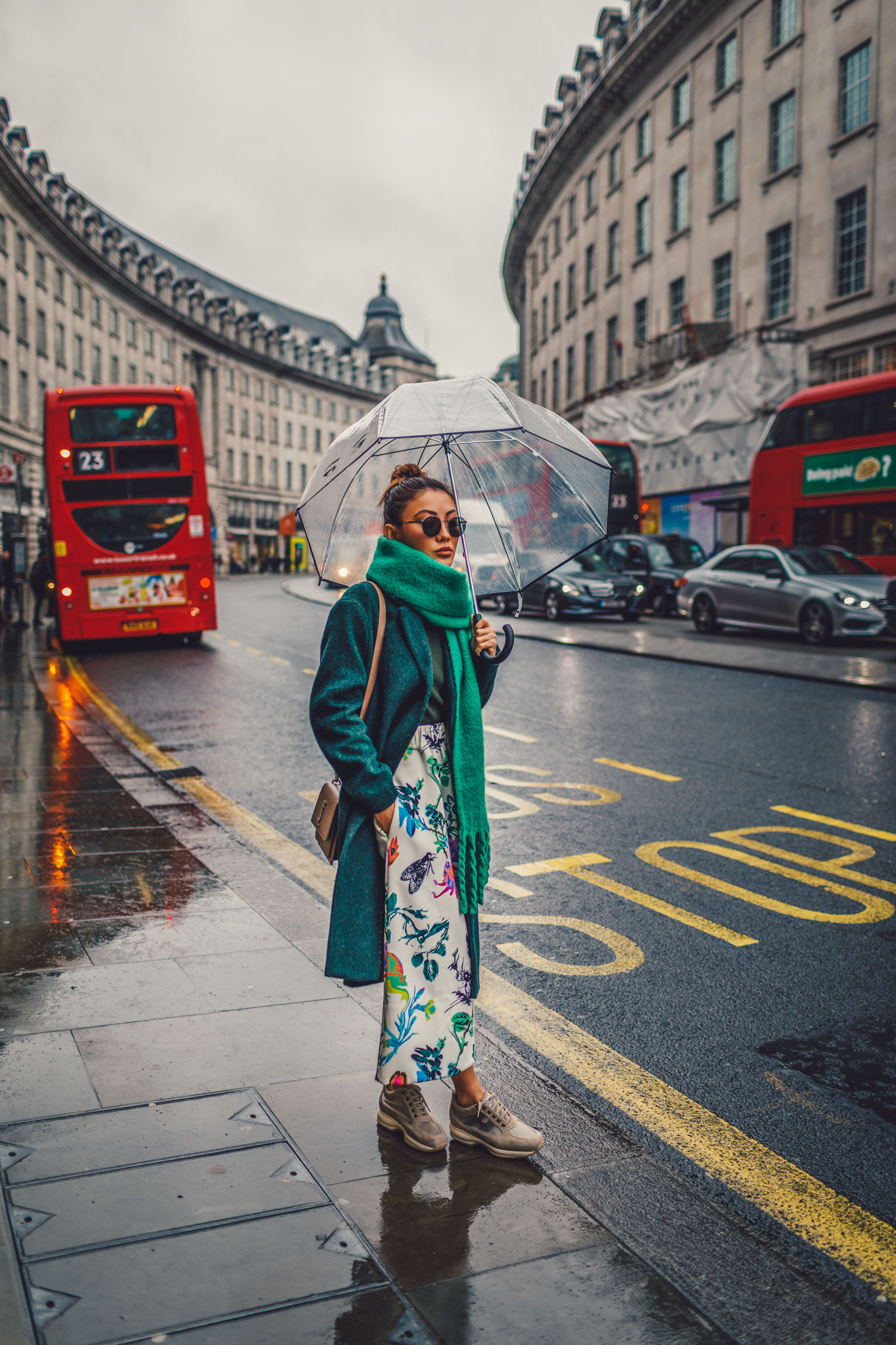 green floral skirt, green coat, dad sneakers, clear umbrella in london, lfw street style // Notjessfashion.com