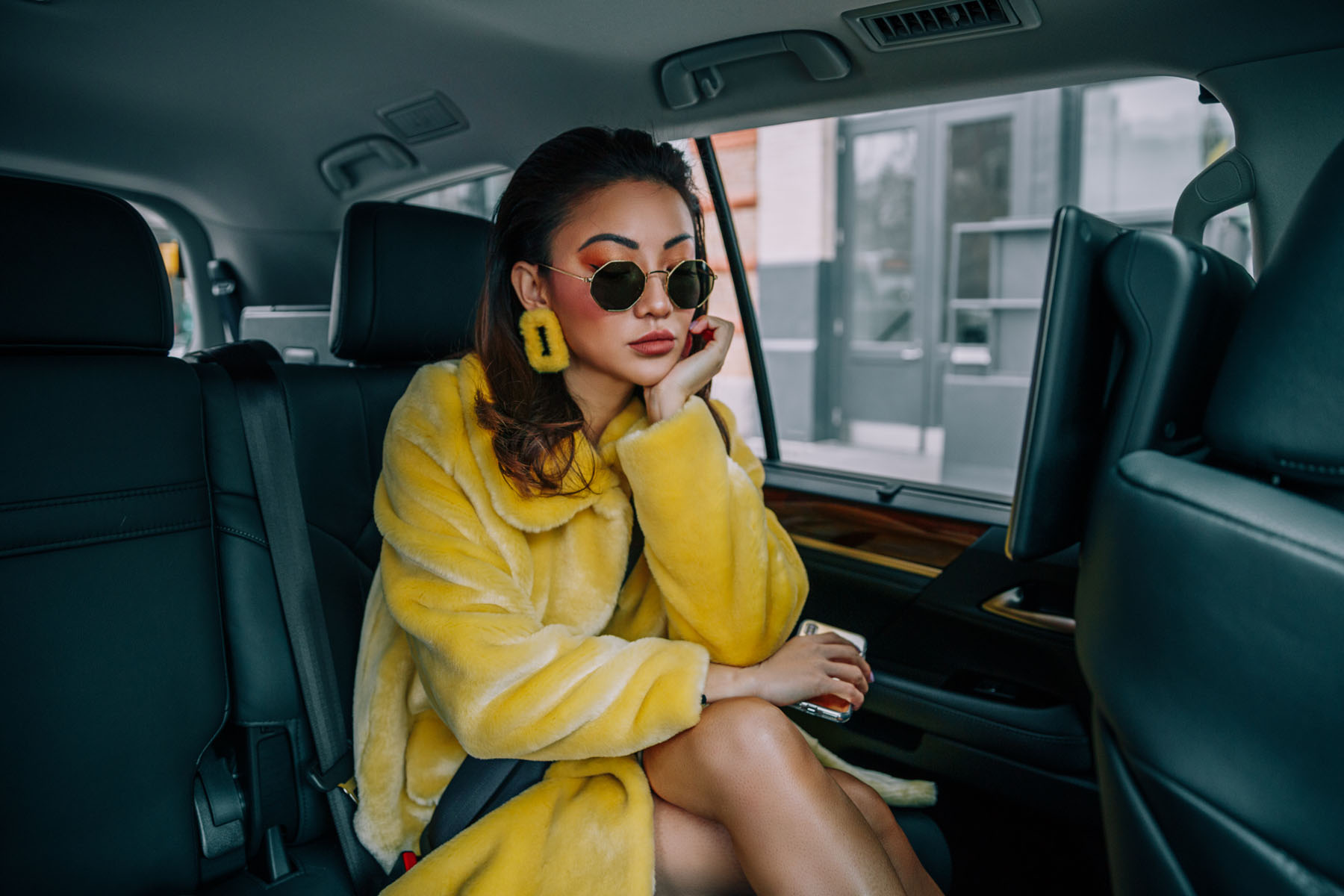 The Best Way to Get Around During NYFW // Notjessfashion.com // Yellow Fur Coat, Yellow Earrings, NYFW Street Style, uber