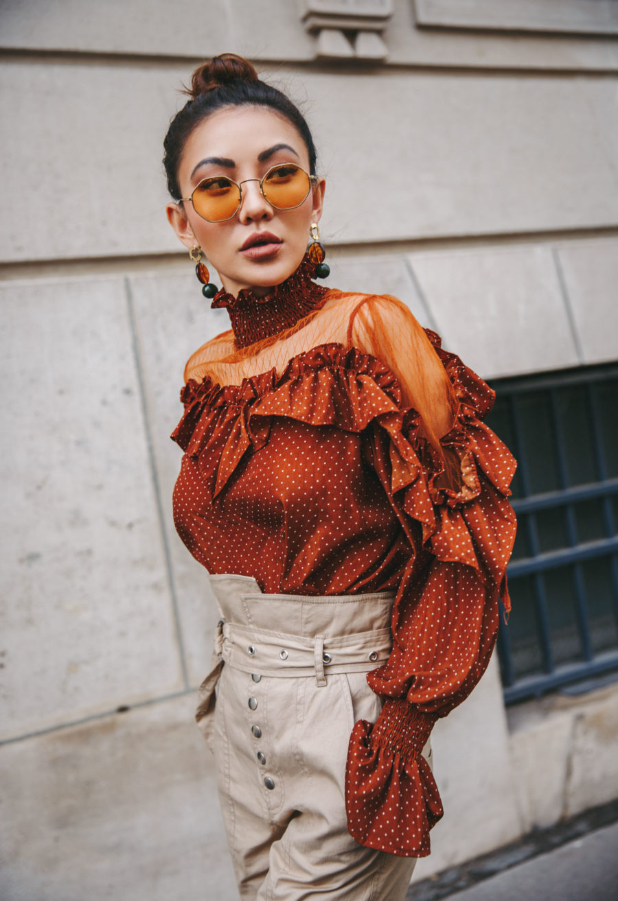 5 Must-Have Sunglasses Every It-Girl Is Wearing Now - Colored Lenses Sunglasses, Orange ruffle top, Spring style, Streetstyle, Highwaisted Beige Pants, Jessica Wang // NotJessFashion.com