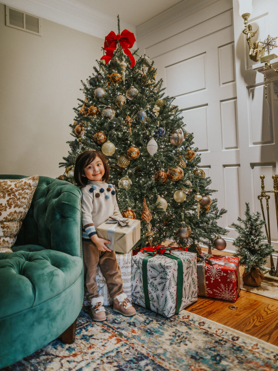 fashion blogger jessica wang's daughter by the christmas tree sharing holiday gifts that give back // Jessica Wang - Notjessfashion.com