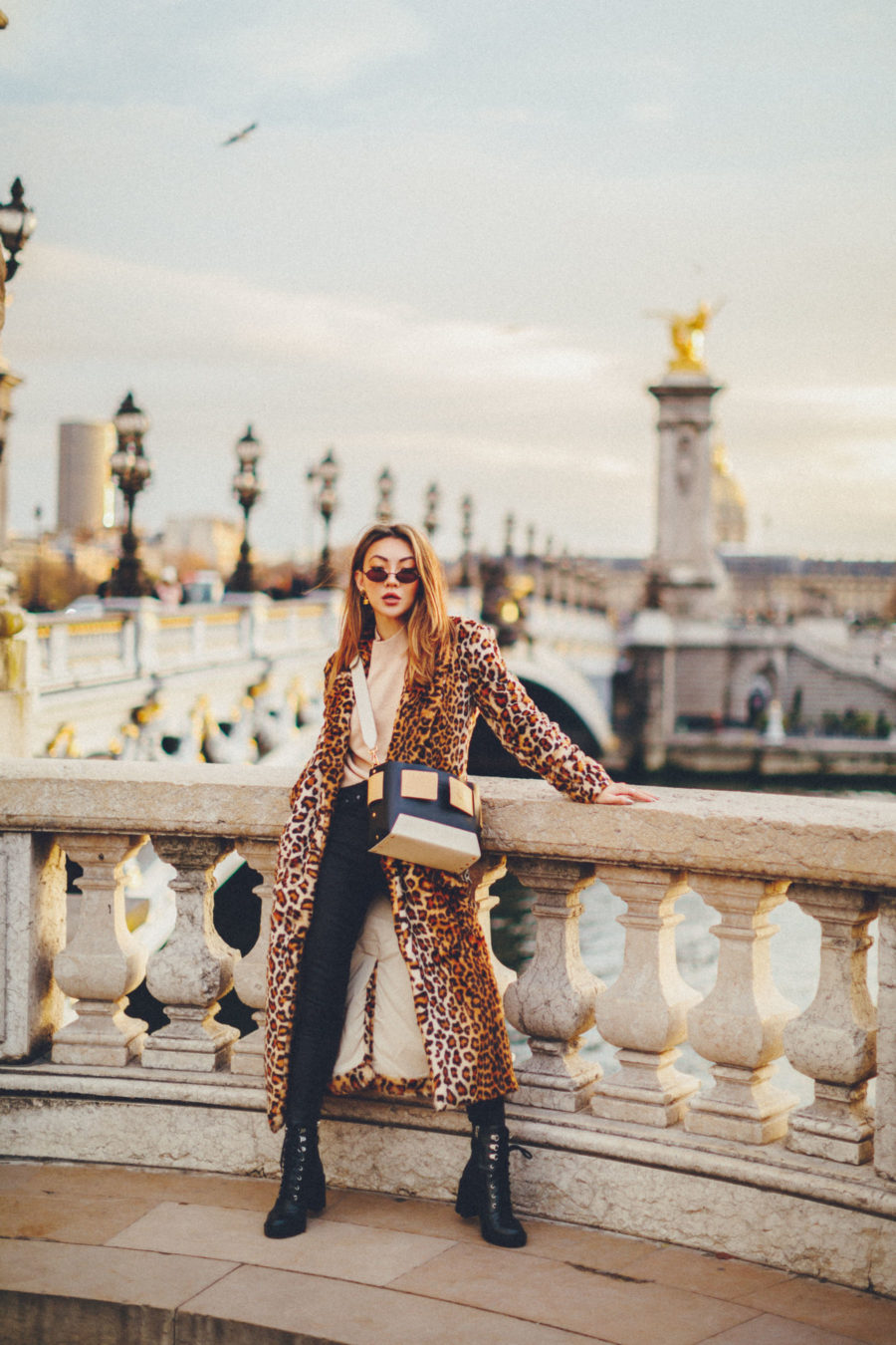 holiday travel looks at pont alexandre iii bridge wearing leopard coat and yuzefi bag // Notjessfashion.com