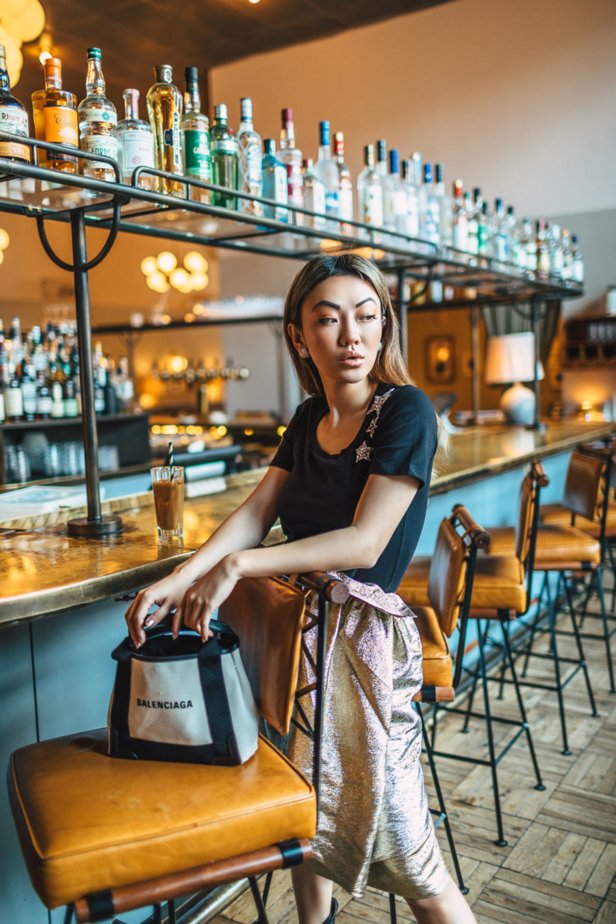 fashion blogger jessica wang shares holiday outfit ideas wearing metallic skirt with sequin star t-shirt // Notjessfashion.com