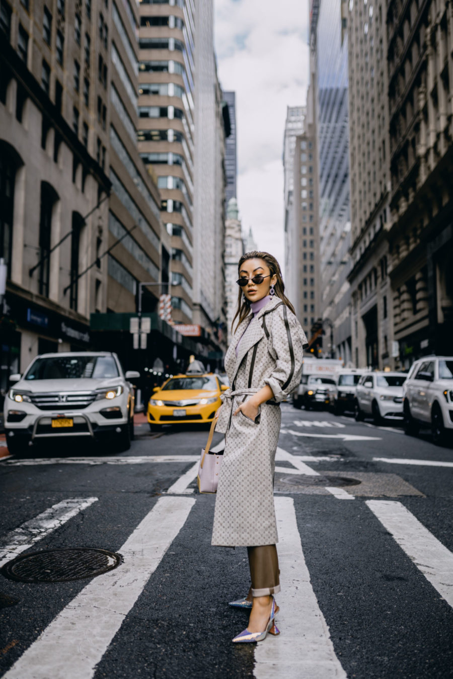 beige outfits, louis vuitton logo jacket,  louis vuitton trench, trench coat and leather trousers, fashion week street style // Notjessfashion.com