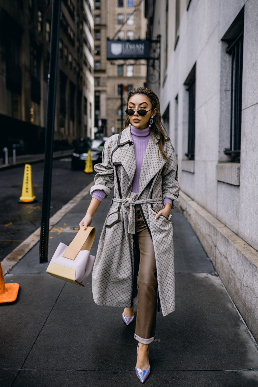 Jessica Wang wearing a patterned duster coat, a purple turtleneck sweater, leather pants, and holographic pumps by amina muaddi // Jessica Wang - Notjessfashion.com