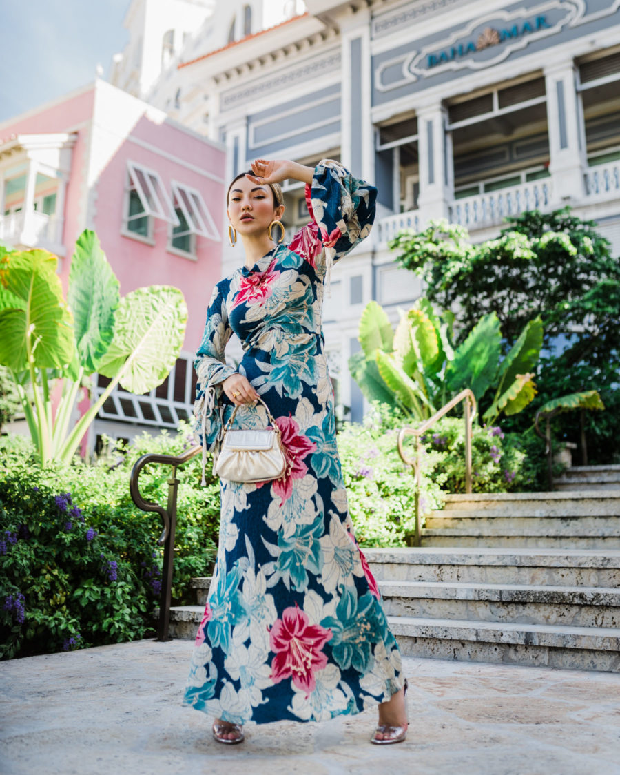 Jessica Wang wearing a trendy vacation outfit featuring a floral maxi dress // Jessica Wang - Notjessfashion.com