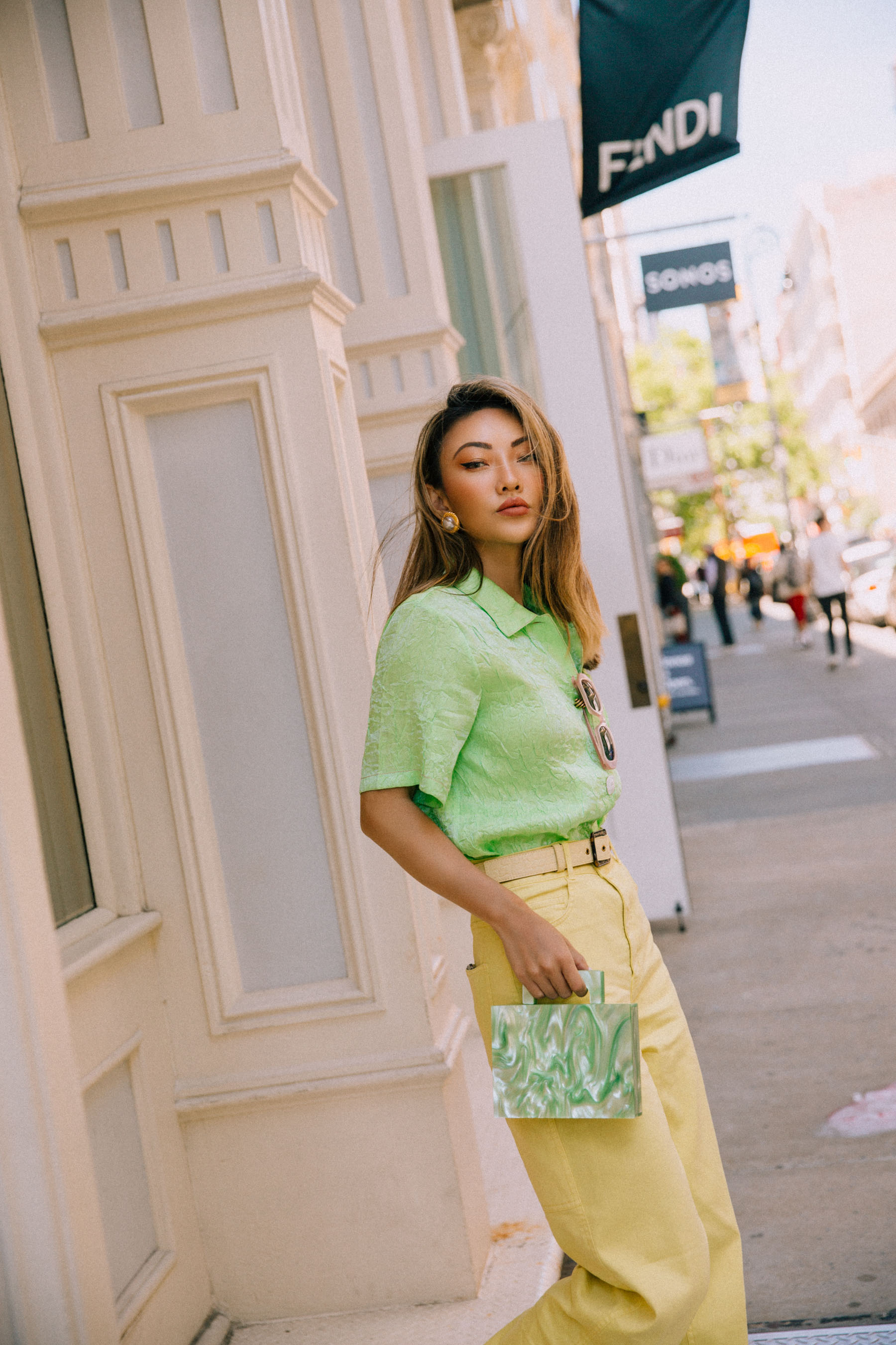 nude belt, sunglasses, Kenneth Jay Lane clip ons - Gold-tone faux pearl clip earrings, rejina pyo crinkle effect satin shirt in green, yellow jeans, How to prepare for a big night out// Notjessfashion.com