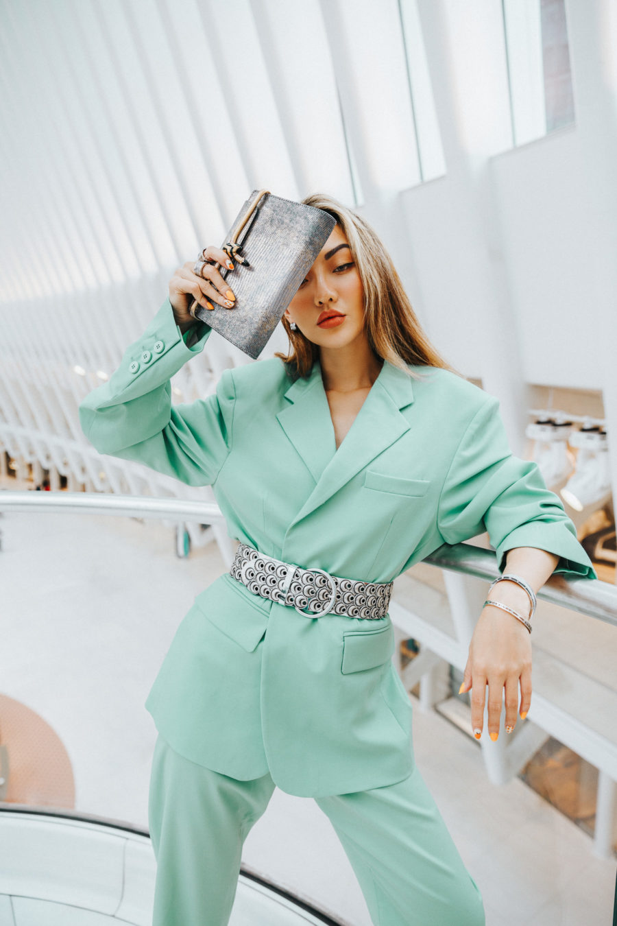 jessica wang wearing a pastel blue blazer with matching pants and a silver belt while sharing casual spring suits for women // Jessica Wang - Notjessfashion.com
