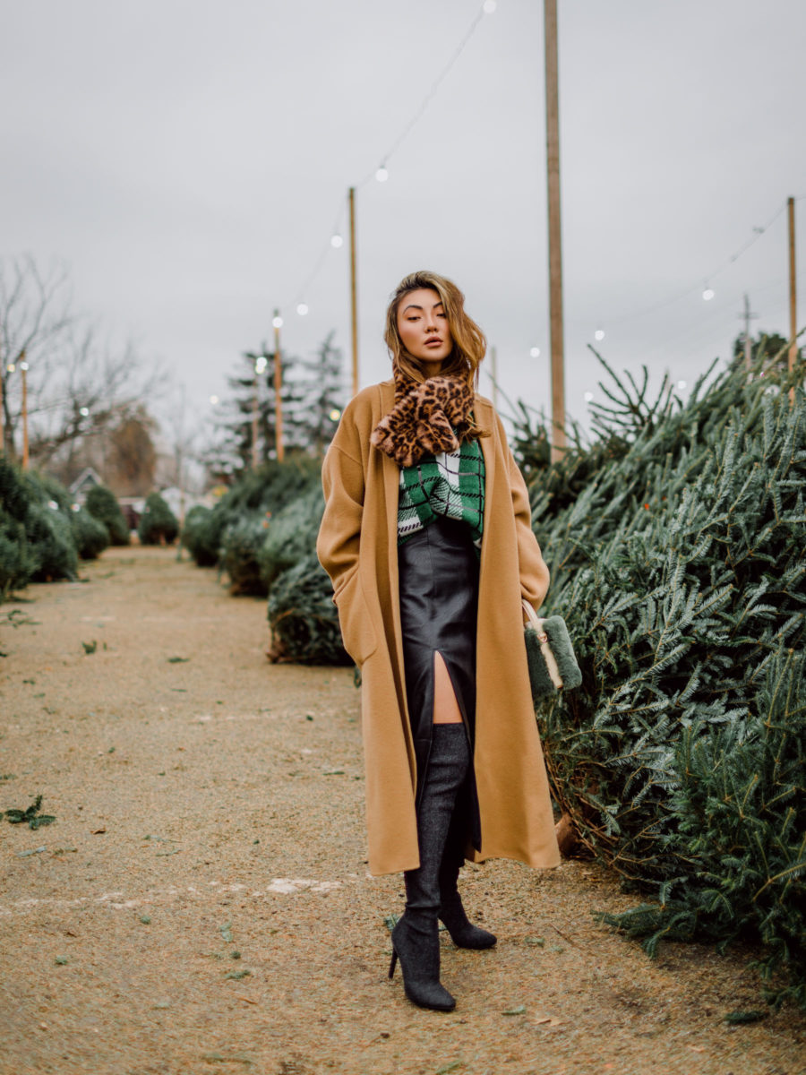 Jessica Wang wearing a camel coat and a leather midi skirt while sharing her cozy essentials for winter // Jessica Wang - Notjessfashion.com