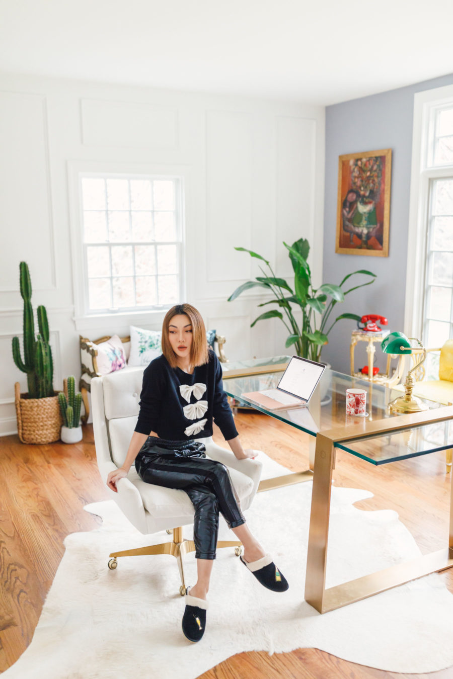 jessica wang sitting in home office with leather joggers and slippers sharing fall candles // Jessica Wang - Notjessfashion.com