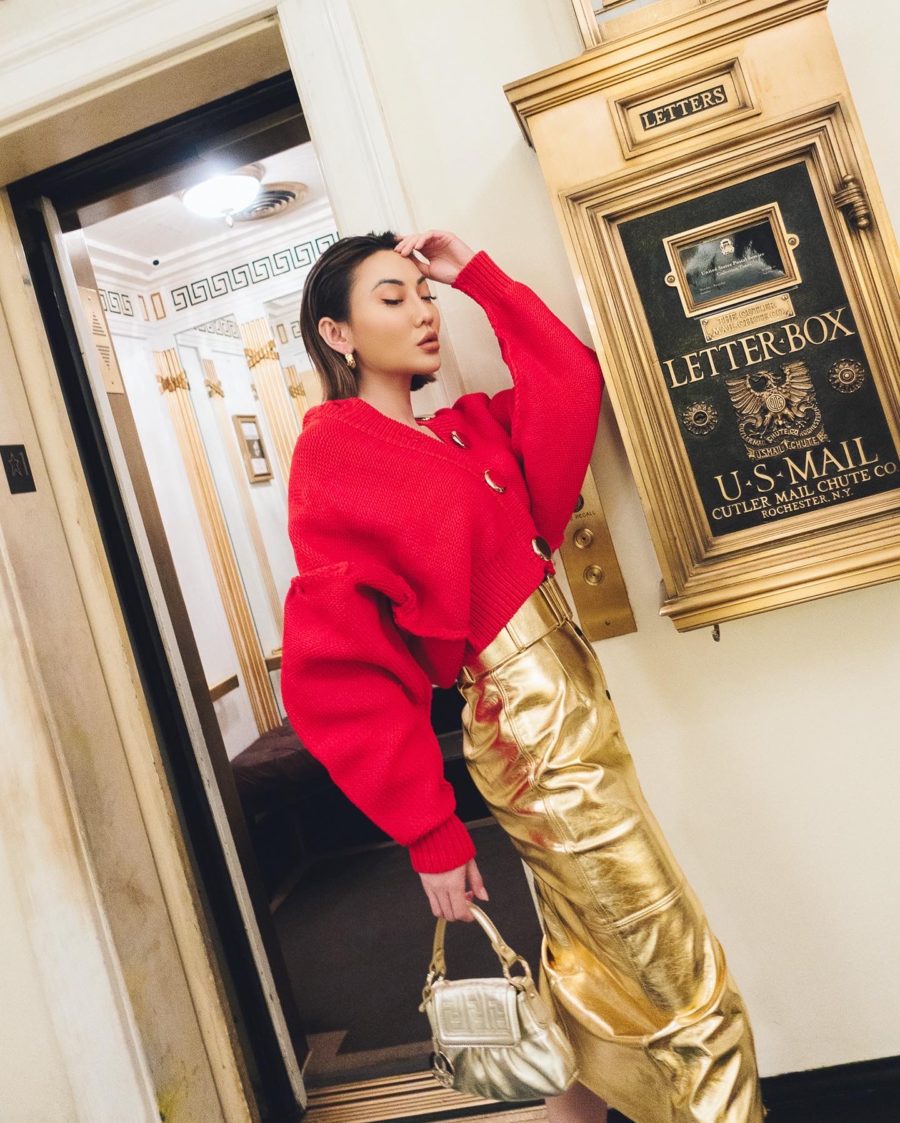 Jessica Wang wearing a red cardigan with a metallic gold skirt while sharing New Year's Eve outfits // Jessica Wang - Notjessfashion.com