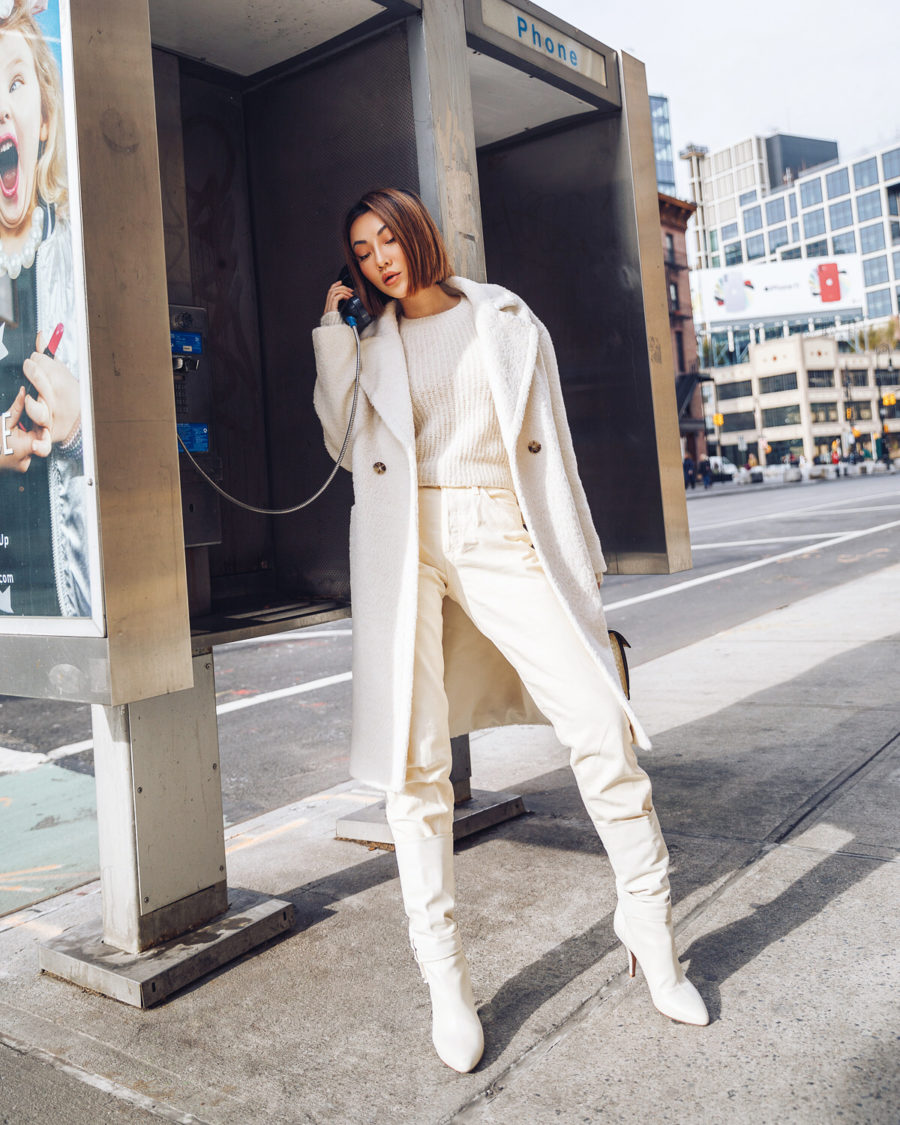 fashion blogger jessica wang shares ways to look more sophisticated on a budget wearing a white shearling coat and knee high boots // Notjessfashion.com