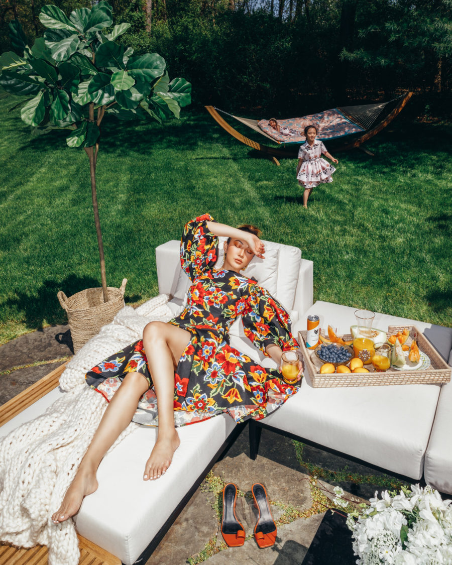 jessica wang wearing a carolina herrera floral dress with neous leather sandals while sharing her favorite amazon outdoor living space finds // Jessica Wang - Notjessfashion.com