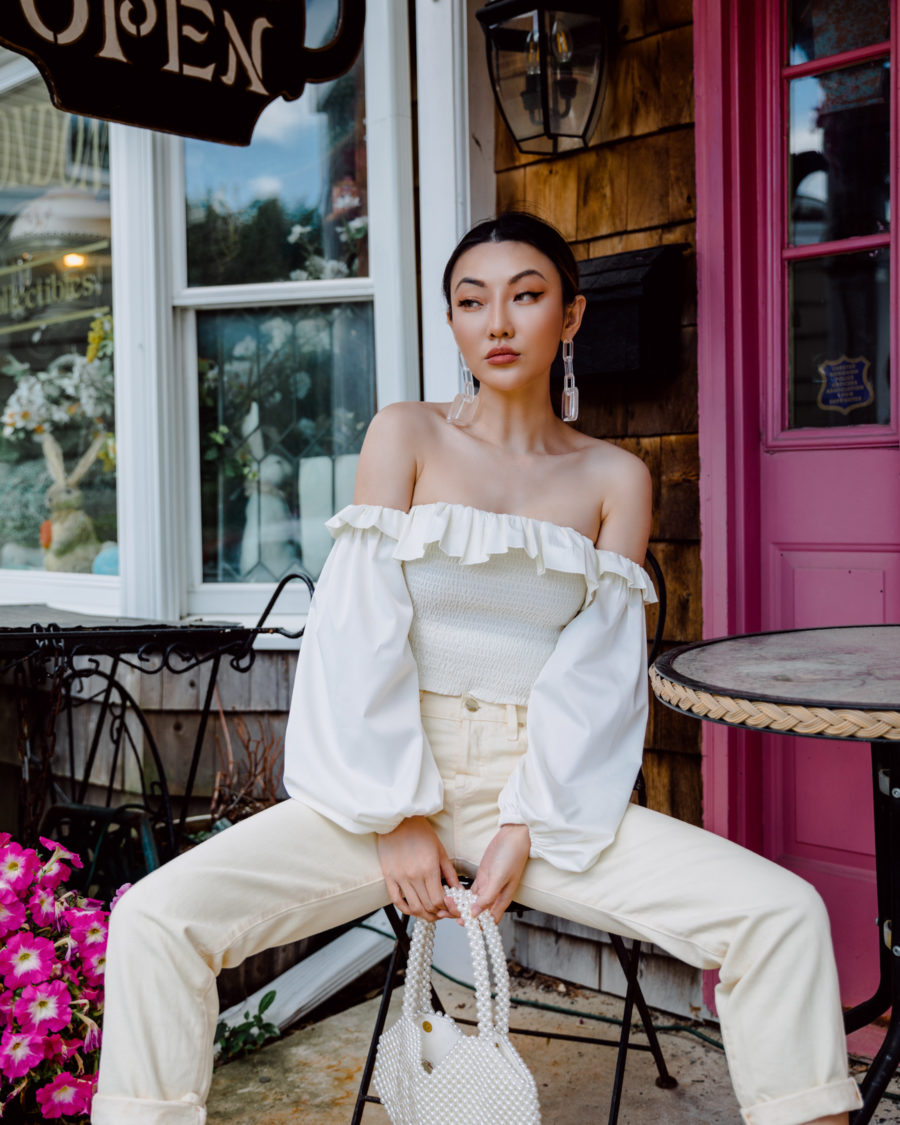 jessica wang wearing a white smocked off the shoulder top with off white denim while sharing her favorite spring trends on amazon // Jessica Wang - Notjessfashion.com