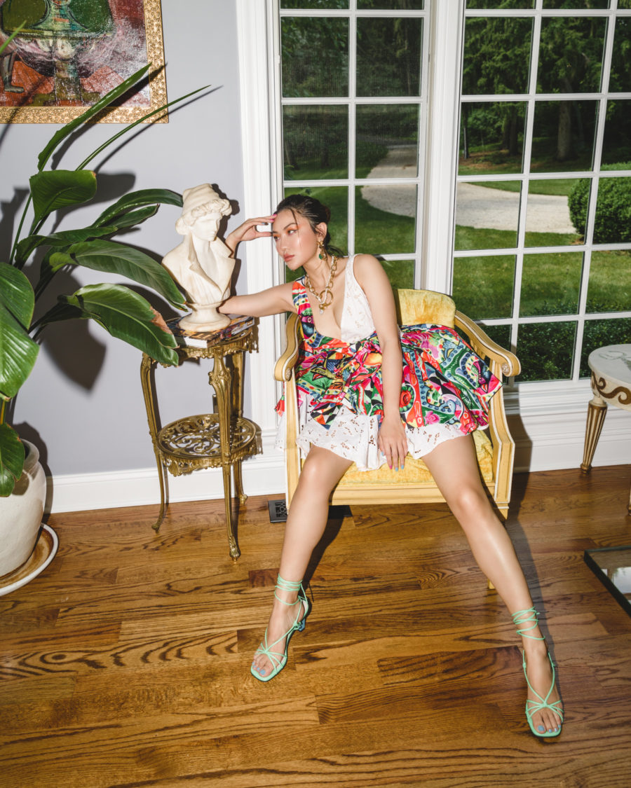 jessica wang wearing a floral dress while sitting in a vintage chair in her home office // jessica wang - Notjessfashion.com