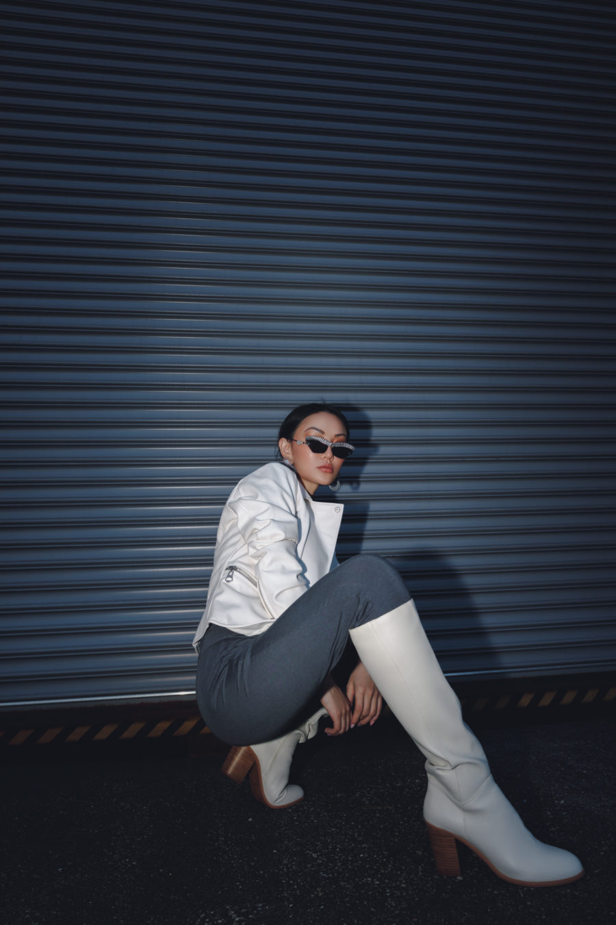 jessica wang wearing a white moto jacket with gray pants and knee high boots while sharing her fall capsule wardrobe from the nordstrom anniversary sale // Jessica Wang - Notjessfashion.com
