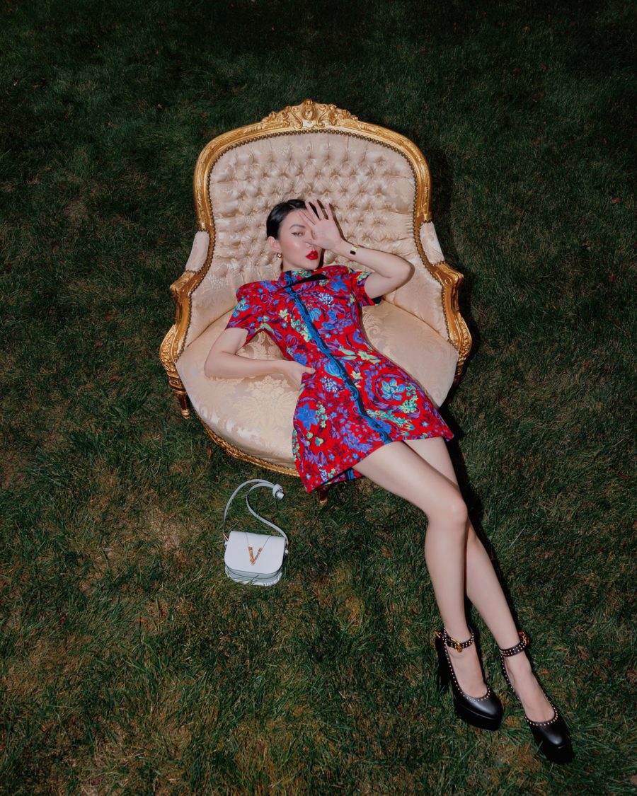 jessica wang wearing a red floral mini dress while sitting on stylish furniture // Jessica Wang - Notjessfashion.com