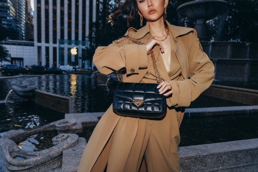 fashion blogger jessica wang wearing a monochromatic camel outfit by michael kors for black friday 2020