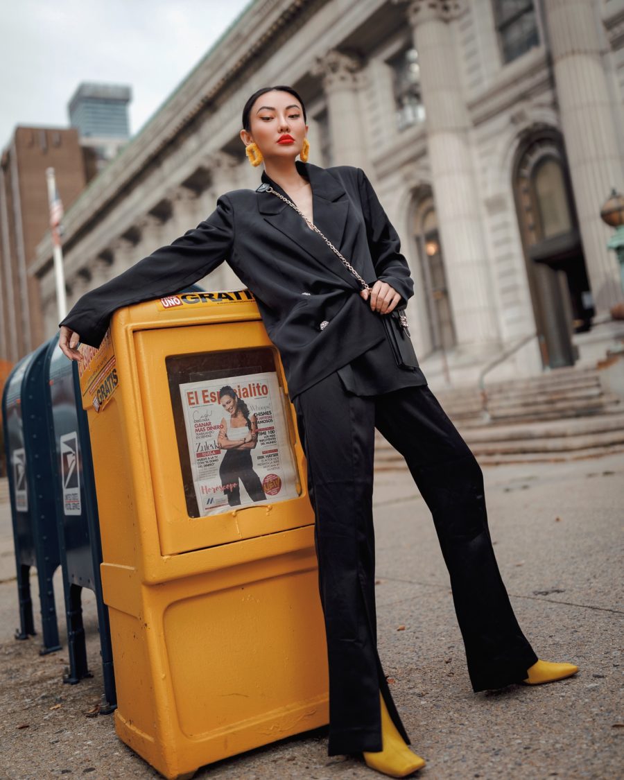 jessica wang wears yellow boots and a black suit while sharing how to make your winter outfits pop // Jessica Wang - Notjessfashion.com