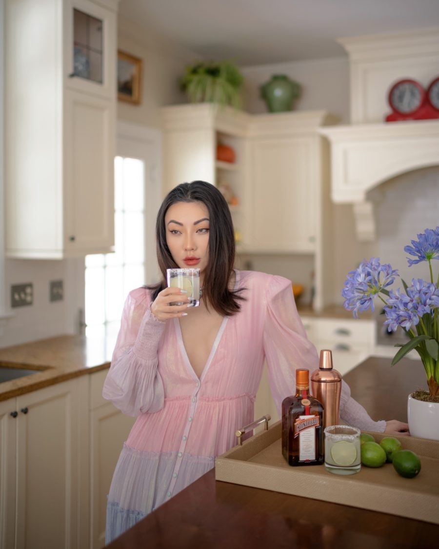 Jessica Wang wearing a plunging v neck dress while sharing her favorite crowd pleasing gifts from amazon