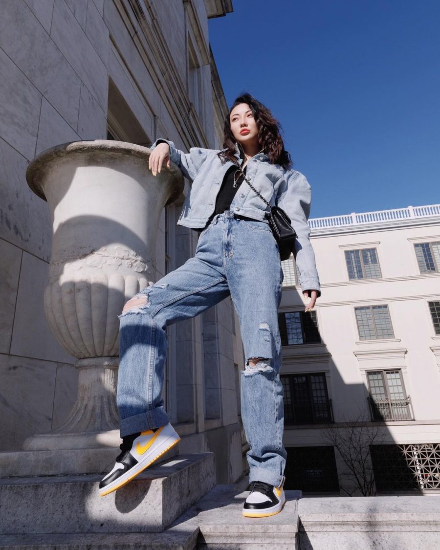jessica wang wearing tiktok fashion trends featuring a blue jean jacket with a black blouse and distressed loose denim // Jessica Wang - Notjessfashion.com