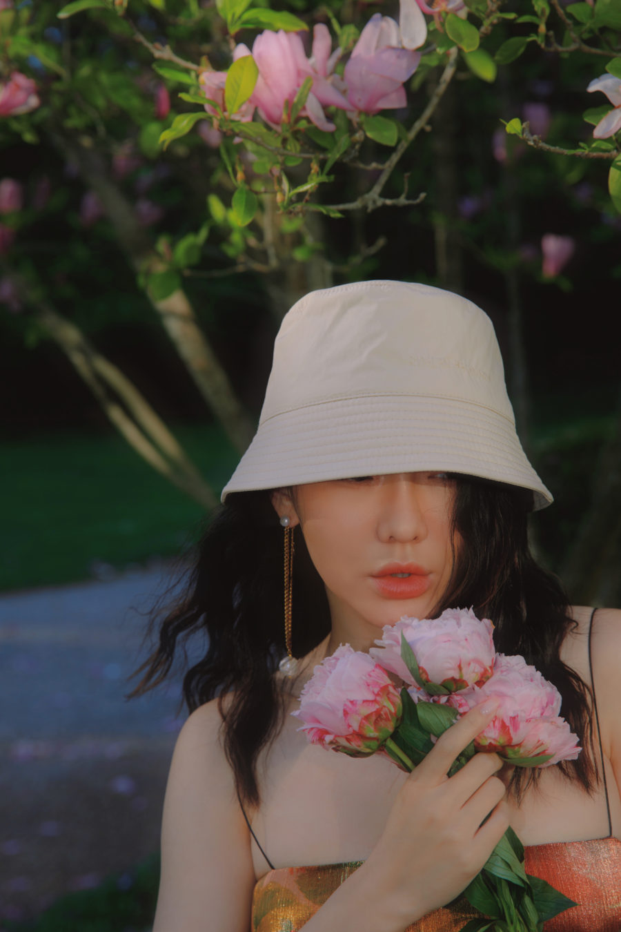 jessica wang wearing a bucket hat and flowers while sharing last minute mother's day gifts at luisaviaroma // Jessica Wang - Notjessfashion.com