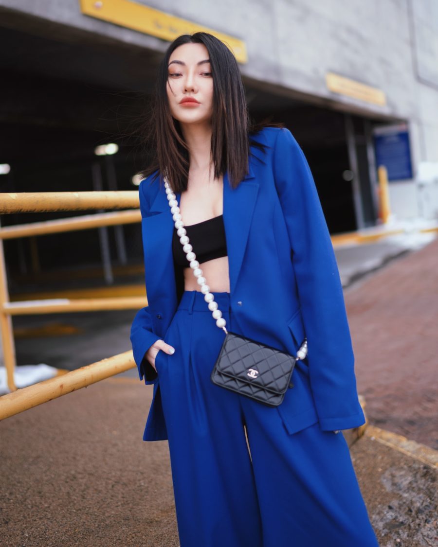 Jessica Wang wearing chic wardrobe staples featuring a blue suit set with a crossbody bag // Jessica Wang - Notjessfashion.com