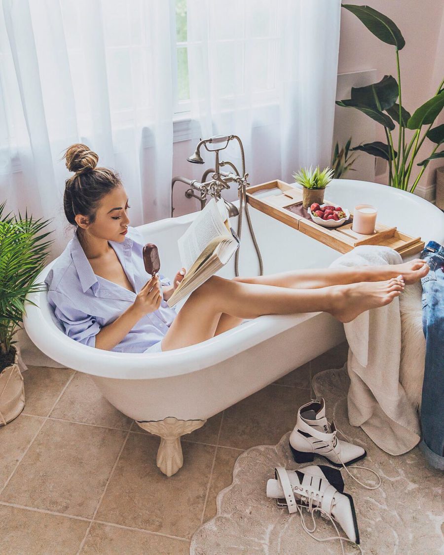 jessica wang wearing an blue button down shirt while sharing her favorite amazon bathroom decor // Jessica Wang - Notjessfashion.com