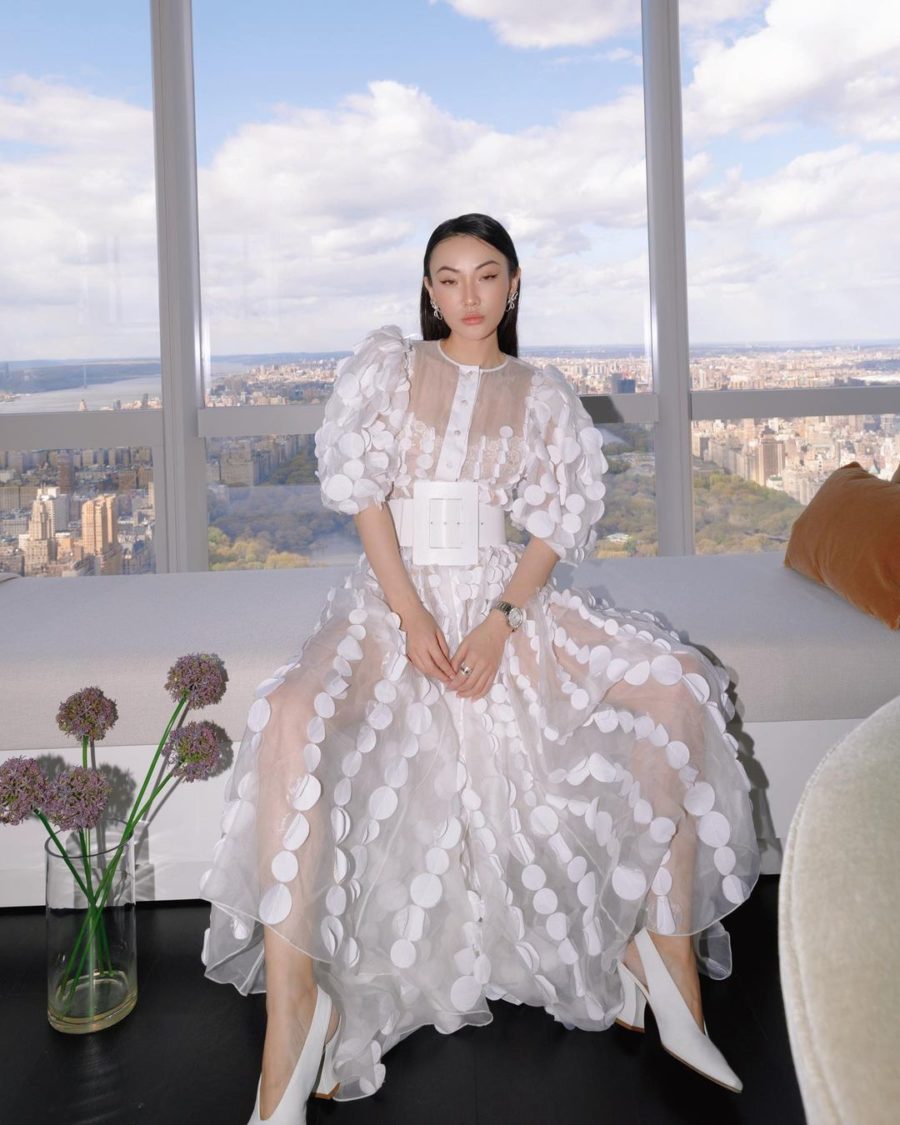 jessica wang wearing a white sheer dress and a wide white belt while sharing her favorite out of the box accessories to elevate your outfits // Jessica Wang - Notjessfashion.com