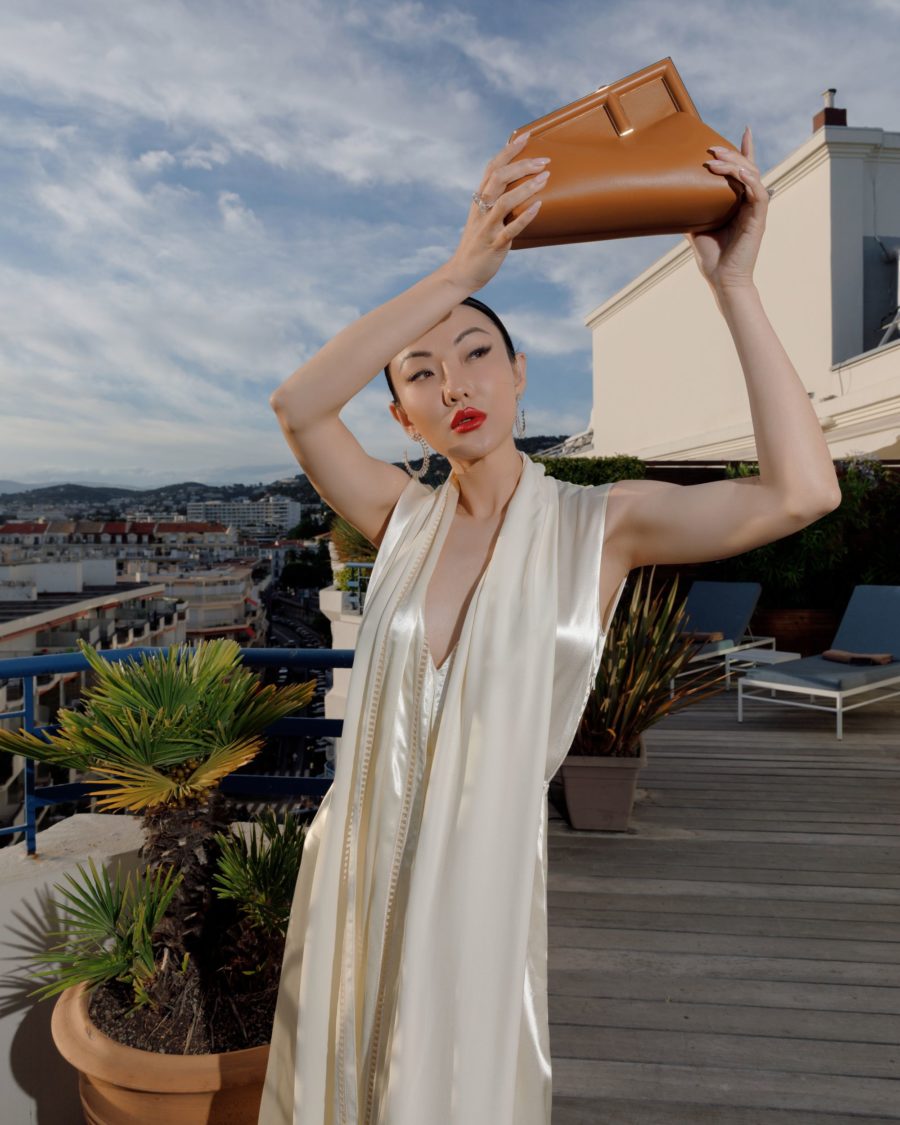 jessica wang wearing a white fendi satin dress with fendi first leather sandals and fendi first small leather bag for the cannes film festival 2021 // Jessica Wang - Notjessfashion.com