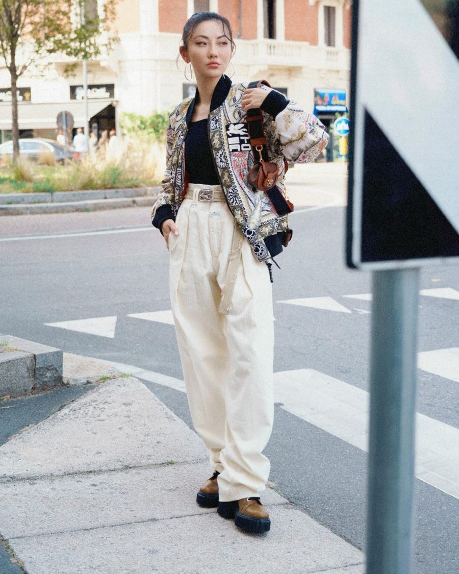 Milan fall street style looks featuring Jessica Wang wearing an oversized bomber jacket with oversized ecru pants and chunky lug sole shoes // Jessica Wang - Notjessfashion.com