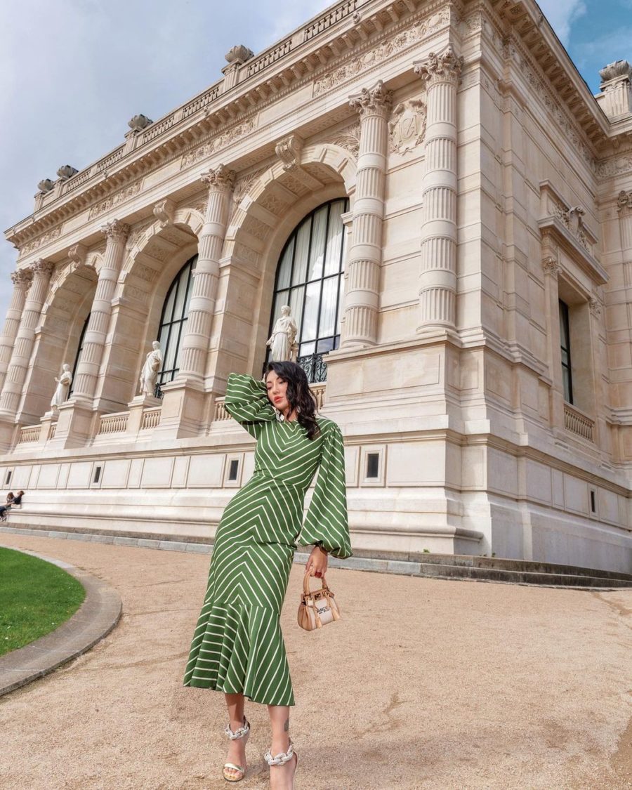 jessica wang wearing a green stripe flared midi dress for chic thanksgiving outfits // Jessica Wang - Notjessfashion.com