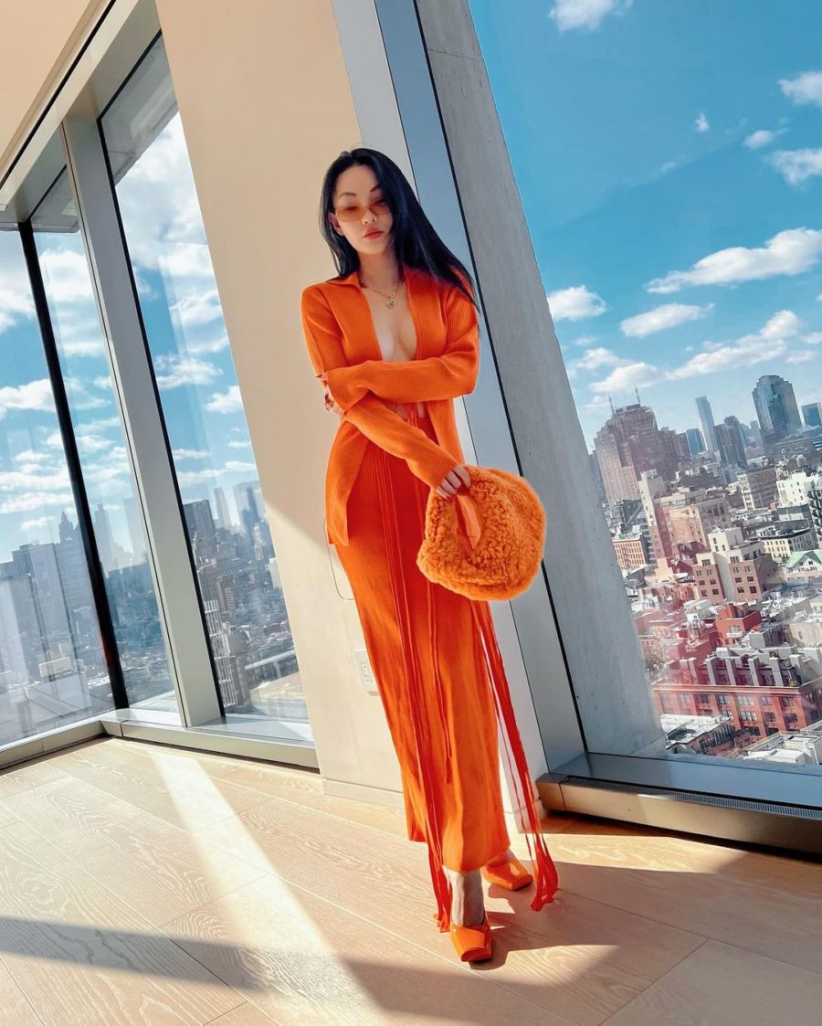 Jessica Wang wearing an orange knit cardigan and knit maxi skirt with a shearling hobo bag while sharing her favorite spring 2022 trends from amazon // Jessica Wang - Notjessfashion.com