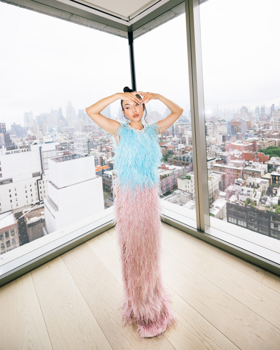 Jessica Wang wearing a blue and pink feather maxi dress while sharing lymphatic drainage at home // Jessica Wang - JessicaWang.com